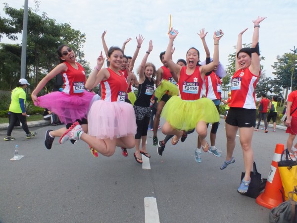 athletic girls jumping wearing tutu