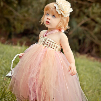 baby girl wearing a peach tutu