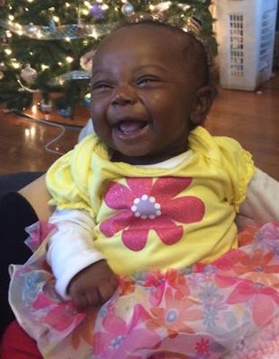 baby girl wearing a peach tutu